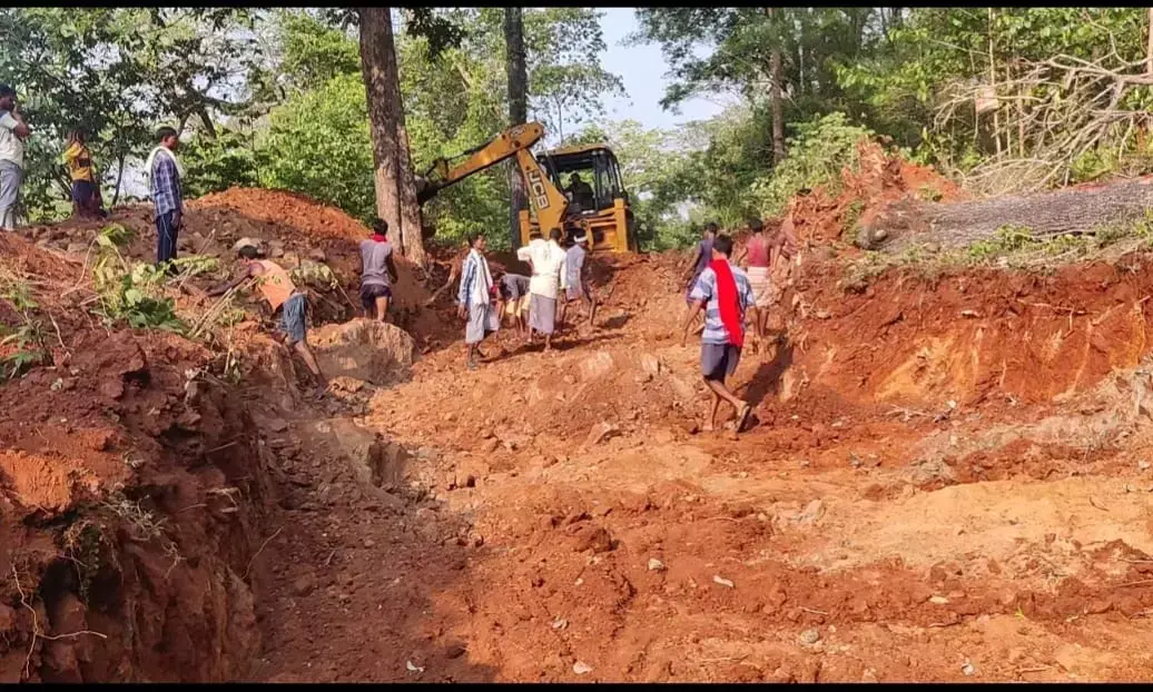 Villagers building a road