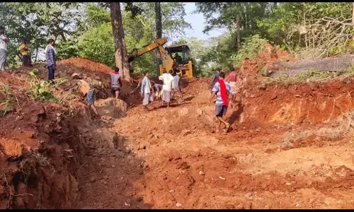 Villagers building a road