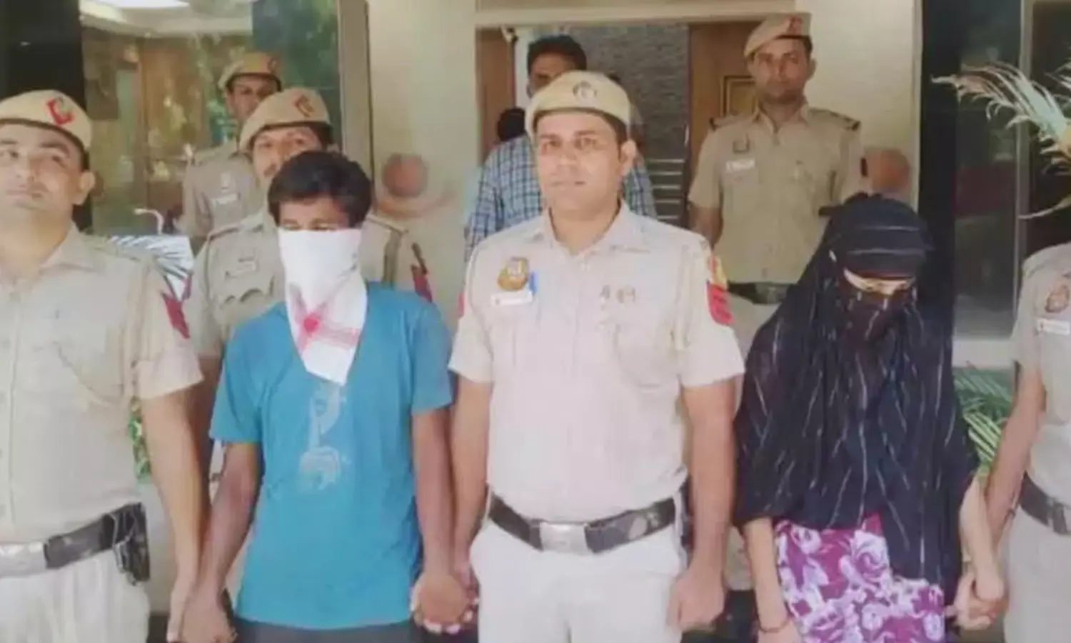 Accused husband and wife in police custody