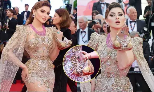 Cannes 2025: Urvashi Rautela carries bikini clutch, blocks stairway for photoshoot