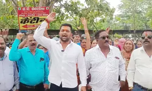 Journalists and health workers shouting slogans