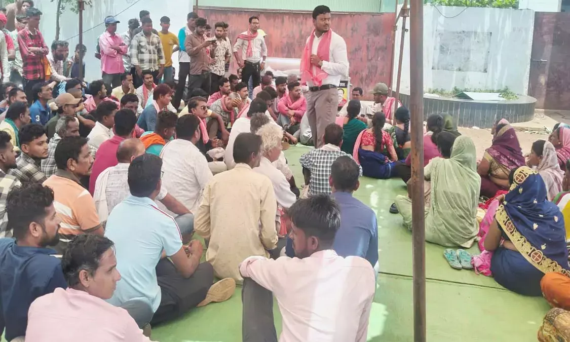 Villagers staging a sit-in protest