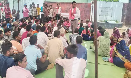 Villagers staging a sit-in protest