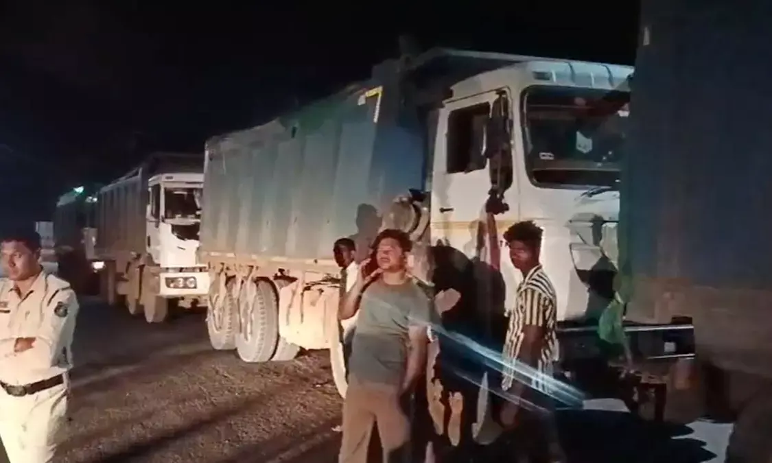 Vehicles loaded with sand