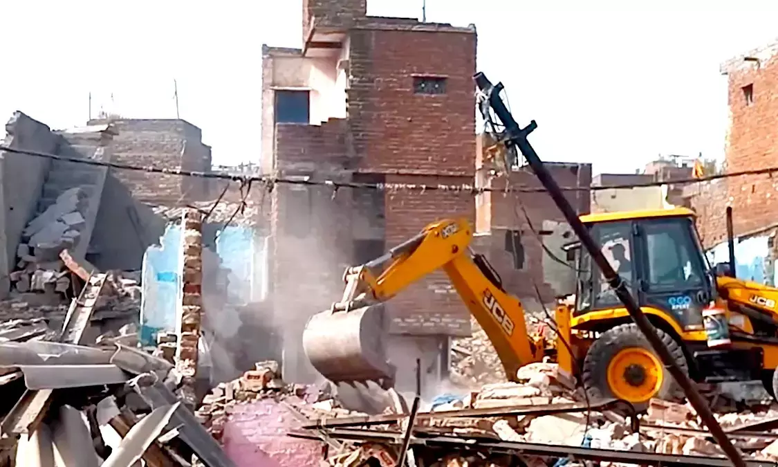 Bulldozer action in bhoomiheen camp of Kalkaji