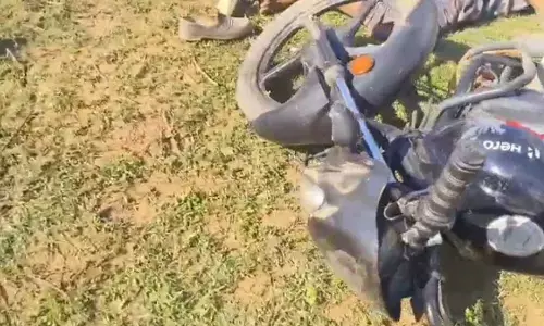 Three people died in a collision between a tractor and a bike