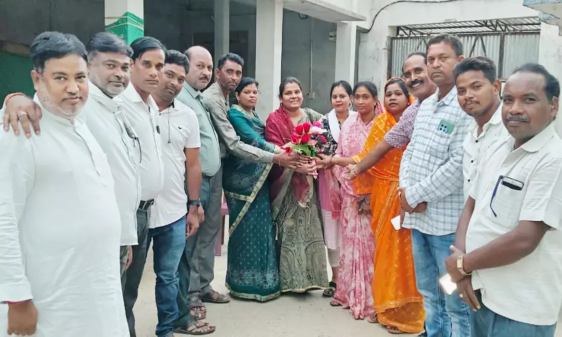 BJP workers presenting a flower bouquet to the district president BJP workers presenting a flower bouquet to the district president