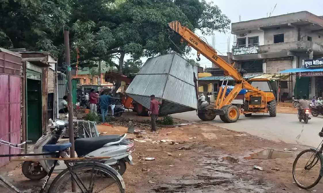 Administrative staff removing encroachment