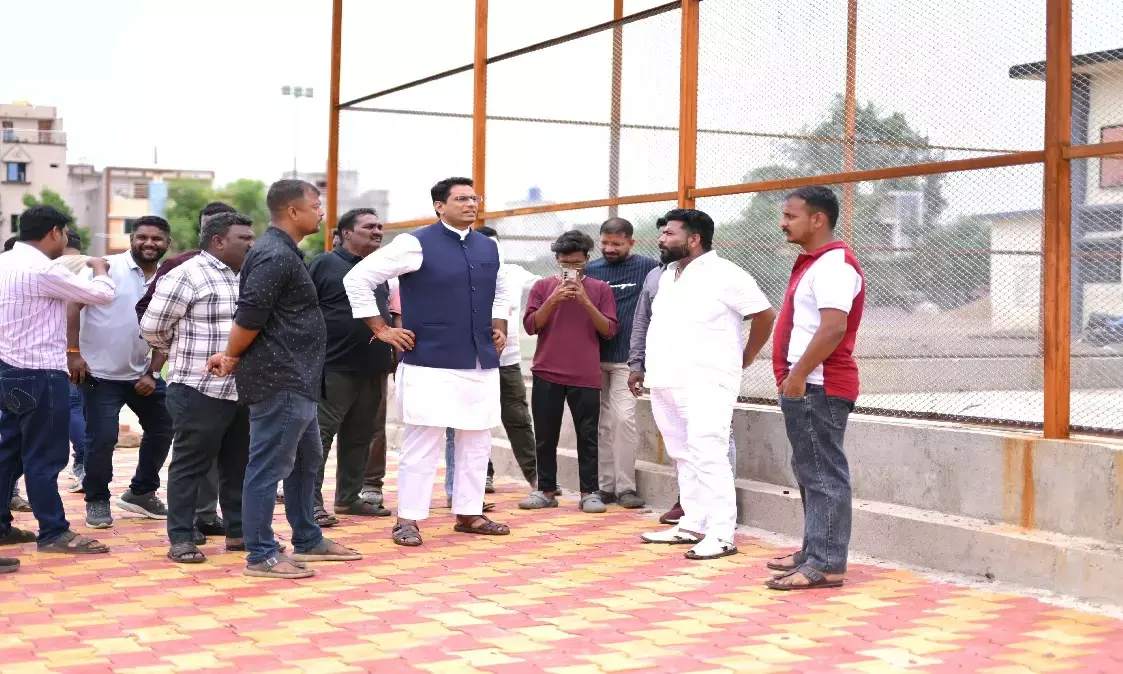 MLA Devendra Yadav inspecting the construction work of the new cricket ground