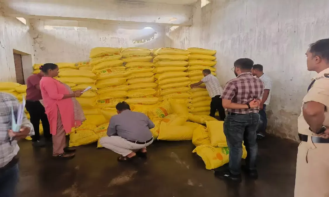 officials inspecting the fertilizer