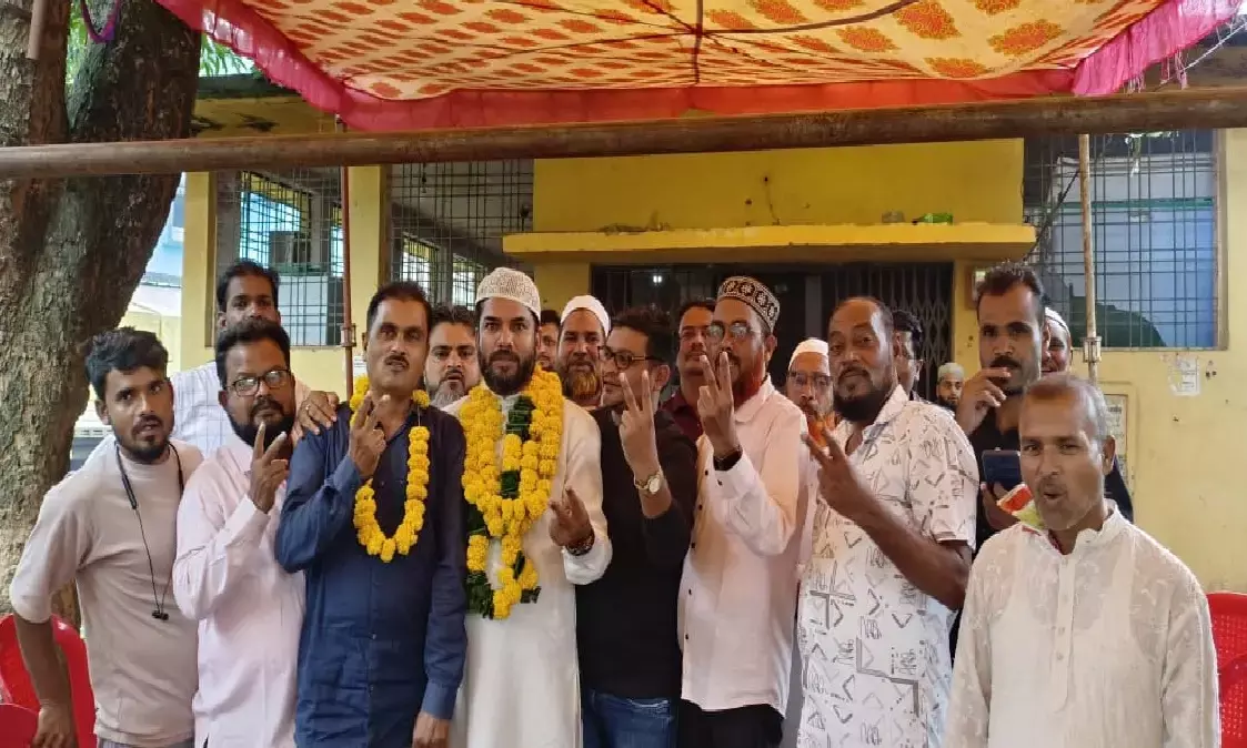 Officials showing victory sign