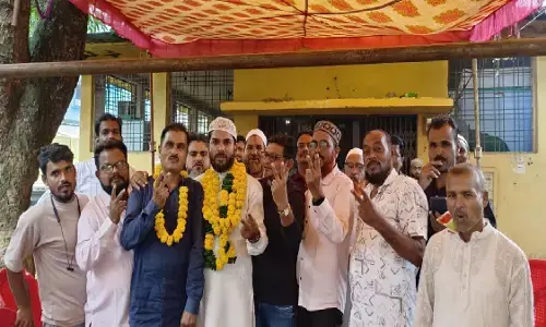Officials showing victory sign