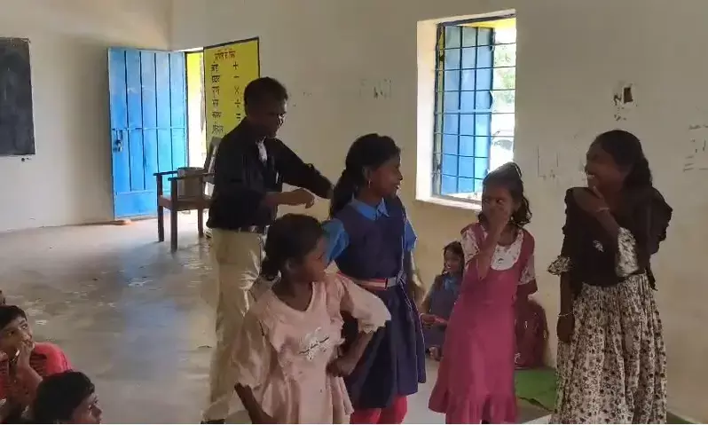 Drunk teacher dances with school girls