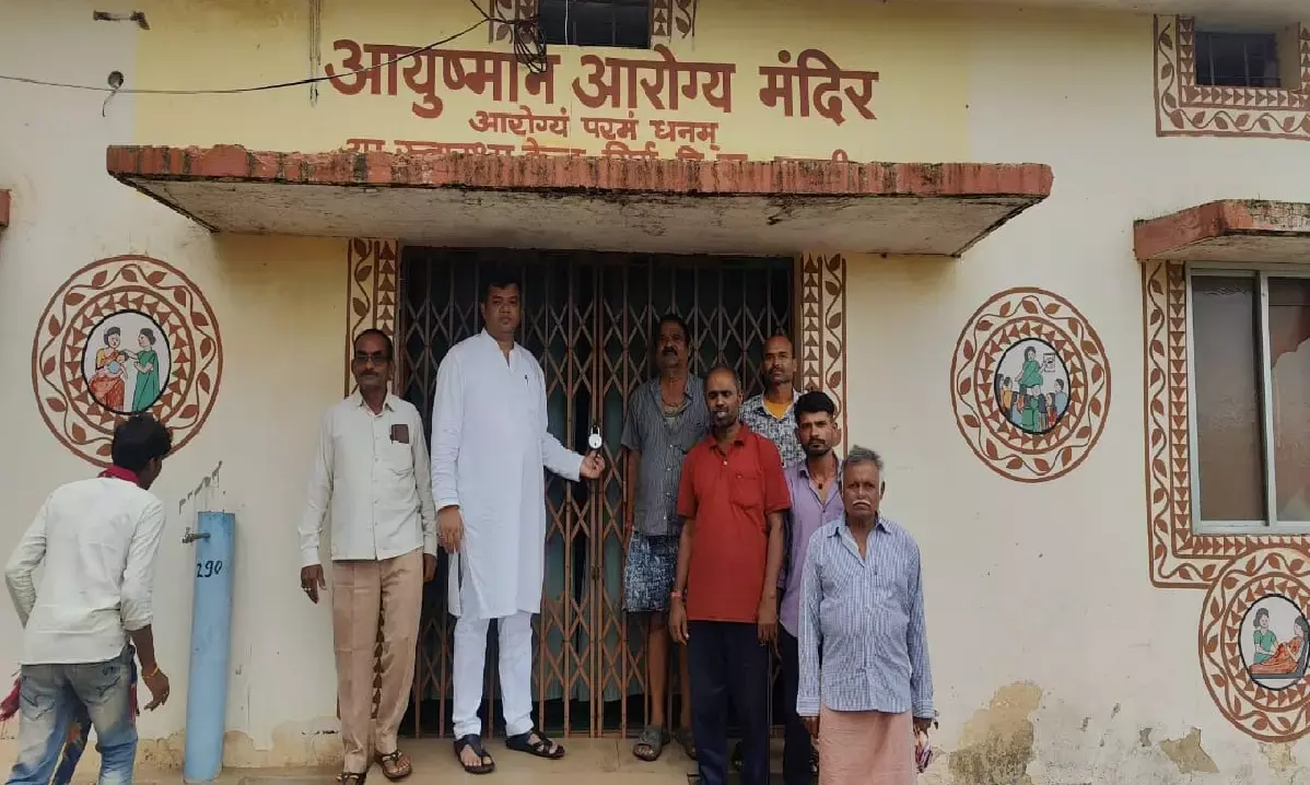 MLA Sandeep Sahu standing outside the health center