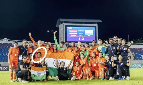 Balods daughter Kiran Pisda with the football team