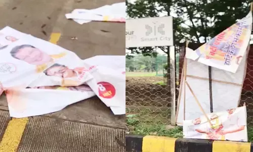 torn posters of leaders