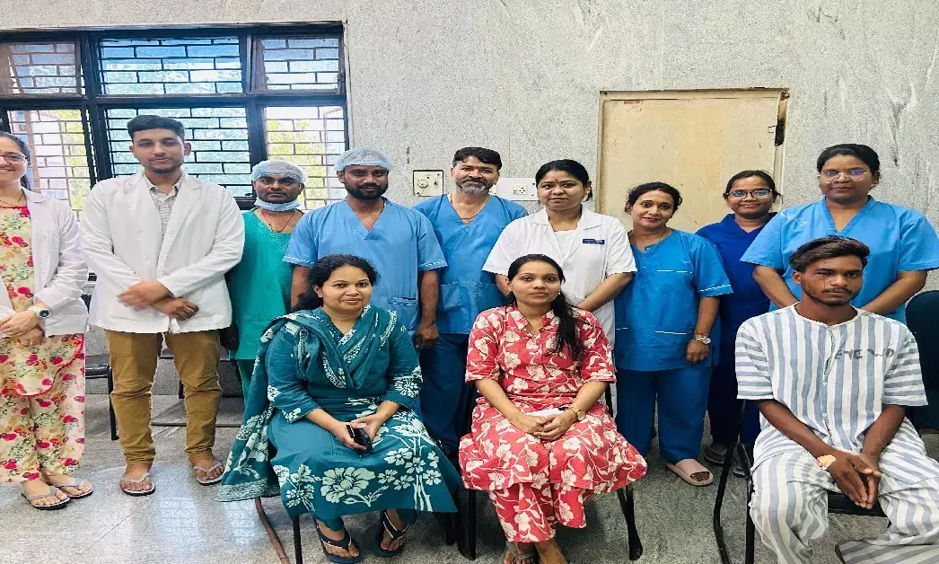 Patient sitting with doctor after successful operation