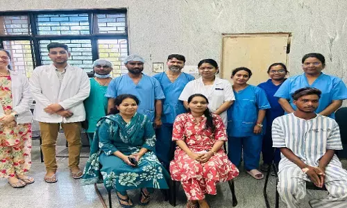 Patient sitting with doctor after successful operation