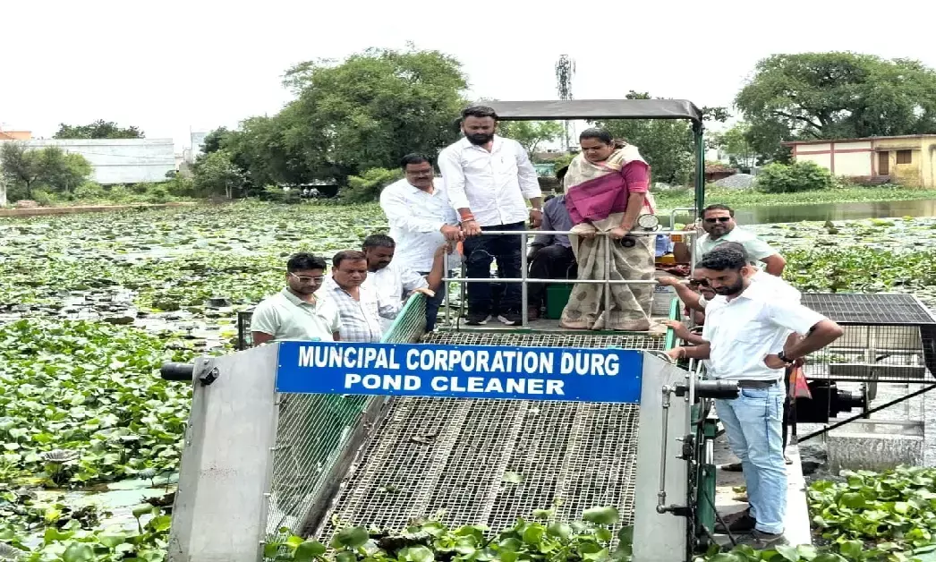 Cleaning is being done with pond garbage cleaning machine