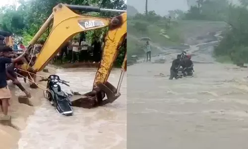 Bike riders stranded in heavy rain