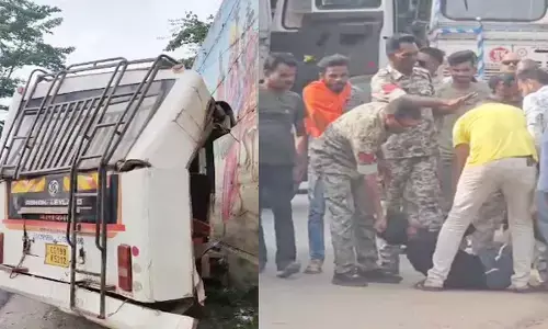 People including police beating the damaged passenger bus and trailer driver People including police beating the damaged passenger bus and trailer driver