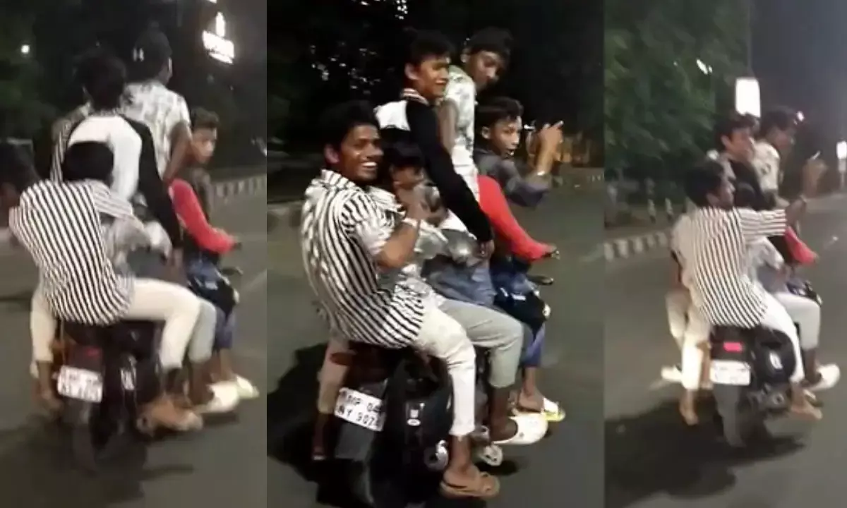 भोपाल: ट्रैफिक नियमों की धज्जियां, एक बाइक पर 6 नाबालिग, बिना हेलमेट कर रहे स्टंट भोपाल: ट्रैफिक नियमों की धज्जियां, एक बाइक पर 6 नाबालिग, बिना हेलमेट कर रहे स्टंट