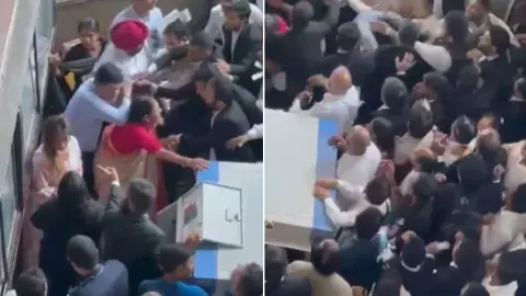 Clashes between lawyers and family at Delhi Tis Hazari court Clashes between lawyers and family at Delhi Tis Hazari court