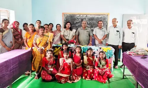 राखी स्कूल में न्योता भोज का आयोजन