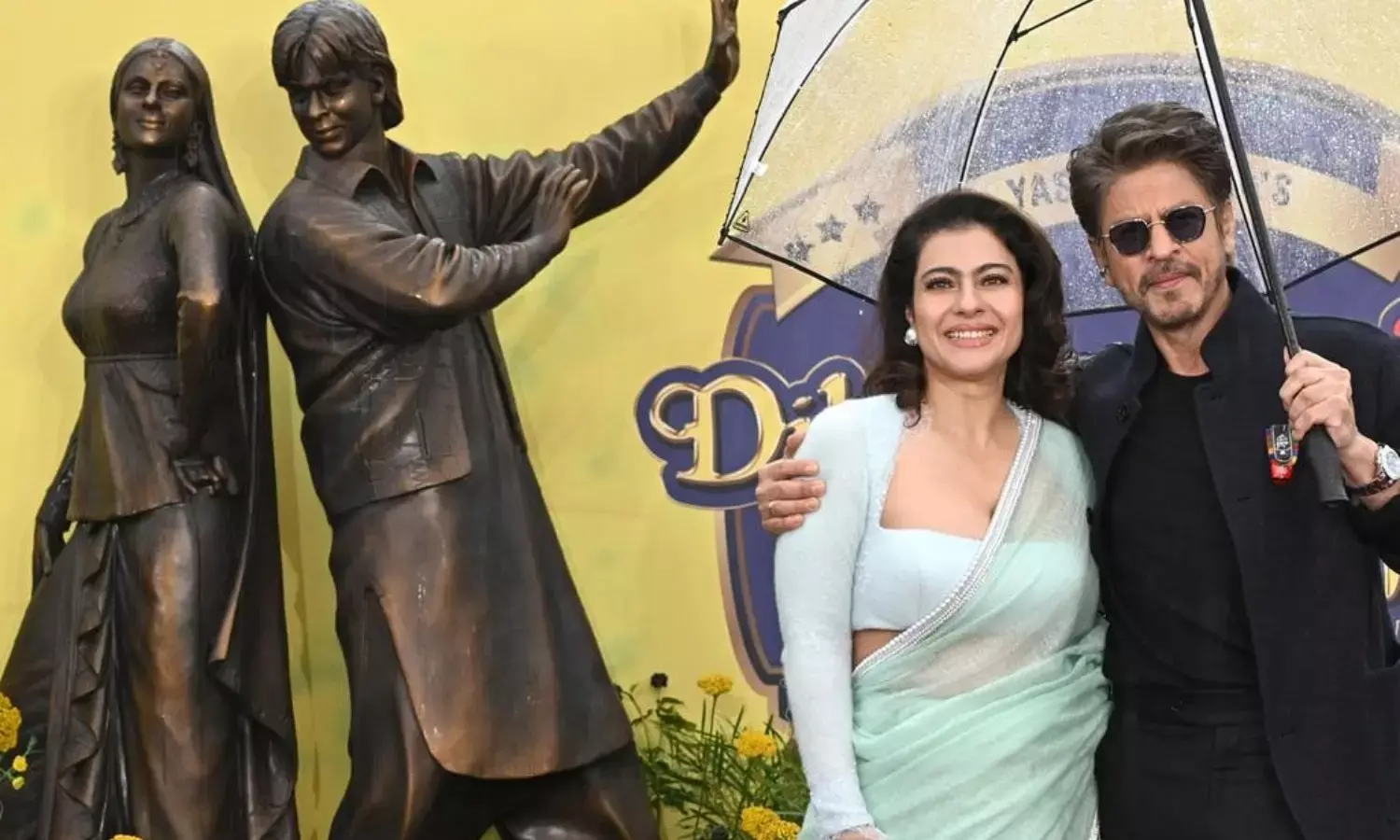 दिलवाले दुल्हनिया ले जाएंगे के 30 साल पूरे होने पर शाहरुख खान और काजोल ने लंदन में अपना आकॉनिक स्टेच्यू का किया अनावरण।